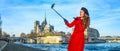 Happy traveller woman in Paris taking selfie using selfie stick Royalty Free Stock Photo