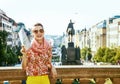 Happy traveller woman on Vaclavske namesti in Prague with map Royalty Free Stock Photo