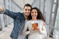 Happy Travellers. Jouful Young Arab Couple Taking Selfie At Airport, Holding Passports Royalty Free Stock Photo