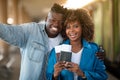 Happy Travellers. Smiling Young Black Couple Taking Selfie At Railway Station Royalty Free Stock Photo