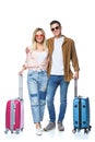 happy travelling couple with suitcases looking at camera