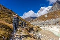 Happy trekker girl hiking in the mountains of Nepal