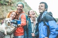 Happy trekkers people making video vlog for social network with gimbal phone - Young hiker friends having fun on mountain Royalty Free Stock Photo