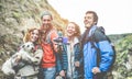 Happy trekkers people making video vlog for social network story with gimbal phone - Young hiker friends having fun on mountain Royalty Free Stock Photo