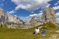 Happy trekkers on plateu in the Dolomites near Cinque torri