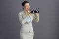 happy trendy business woman in light business suit Royalty Free Stock Photo