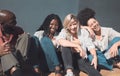 Happy, trendy and carefree friends laughing, talking and having fun enjoying their free time together outside. Diverse Royalty Free Stock Photo