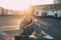 Hipster millennial cute woman on rooftop at sunset