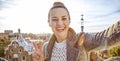 Happy trendy tourist woman in Barcelona, Spain taking selfie