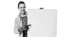 Happy trendy woman on white pointing at blank board Royalty Free Stock Photo