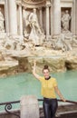 Happy trendy woman in Rome, Italy throwing coin Royalty Free Stock Photo