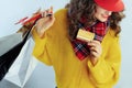 Happy trendy woman shopper showing golden credit card Royalty Free Stock Photo