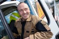 Happy truck driver smiling at camera Royalty Free Stock Photo