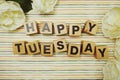 Happy Tuesday alphabet letters on colorful stripes background