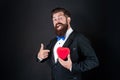 happy tuxedo man pointing finger on heart. happy valentines day. be my valentine. Royalty Free Stock Photo