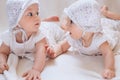 Happy twin sisters playing at home on a white background Royalty Free Stock Photo