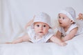 Happy twin sisters playing at home on a white background Royalty Free Stock Photo