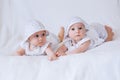 Happy twin sisters playing at home on a white background Royalty Free Stock Photo