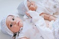 Happy twin sisters playing at home on a white background Royalty Free Stock Photo