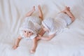 Happy twin sisters playing at home on a white background Royalty Free Stock Photo