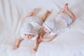 Happy twins in funny hats. Children girls 7 months