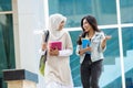 Two asian student walking on campus Royalty Free Stock Photo