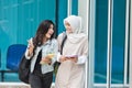 Two asian student walking on campus Royalty Free Stock Photo