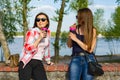 Happy two female friends drinking coffee Royalty Free Stock Photo