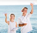 two kids playing paper planes Royalty Free Stock Photo