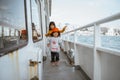 little girl running around the ferryboat