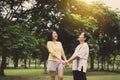 Happy two woman hands holding together at public park in the morning,Happy and smiling,Positive thinking,Healthy and lifestyle con