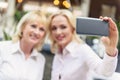 Happy two women making selfie together Royalty Free Stock Photo