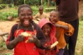 Happy Ugandan Children Eating Sugarcane