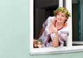 Happy Ukrainian woman in the window