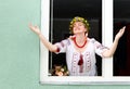 Happy Ukrainian woman in the window Royalty Free Stock Photo