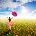 Happy umbrella woman jumping in flower garden and sun sky Royalty Free Stock Photo