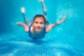 Happy underwater swim pool portrait of girl dive