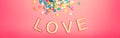 Happy Valentine Day. Beautiful card with colorful hearts candies on pink background. February popular holiday. Wooden words Royalty Free Stock Photo