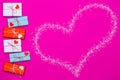 Happy Valentine day composition: bright gift boxes with red heart on pink background Royalty Free Stock Photo