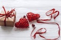 Happy valentine day concept. stylish craft present and two red h Royalty Free Stock Photo