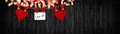 Happy Valentine`s Day background banner panorama long - White paper note hang on wooden clothes pegs with wooden hearts on a Royalty Free Stock Photo