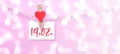 Happy Valentine`s Day background banner - White paper note hang on wooden clothes pegs with wooden hearts on a string isolated on Royalty Free Stock Photo