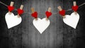 Happy Valentine`s Day background banner - White paper note hang on wooden clothes pegs with wooden hearts on a string isolated on Royalty Free Stock Photo