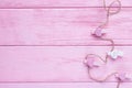 Happy Valentine`s Day. Valentine`s day background. Pink and white hearts TRUE LOVE with clothespins in a clothes line on a pink