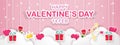 Happy Valentine`s Day banner decorated with symbols of love, Gift box, Hearts, Archer, Rose, hanging with string on Clouds. Royalty Free Stock Photo