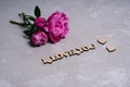 Happy Valentine's Day. A bouquet of pink peonies and a wooden inscription I love you. Royalty Free Stock Photo