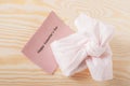 Happy valentine`s day on card with eco-friendly pink gift. on a wooden background