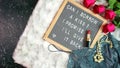 Valentine`s Day flat lay with roses, champagne and letterboard. Royalty Free Stock Photo