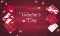 Happy Valentine`s Day greeting background. Top view on gift boxes in different packaging, confetti in the form of heart, garlands