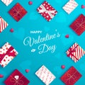 Happy Valentine`s Day greeting card. Top view on gift boxes in different packaging, candy in the form of heart. Festive romantic l